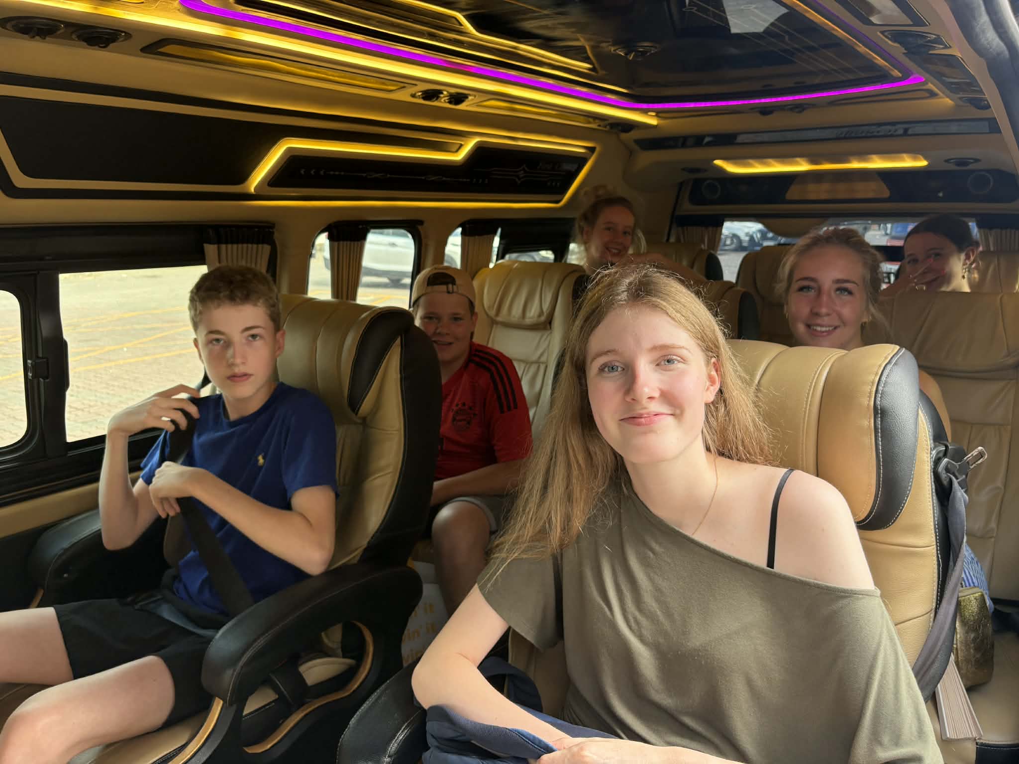 Customers seated inside luxury van